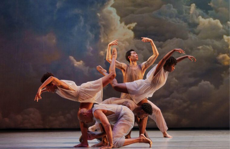 Alvin Ailey American Dance Theatre, Many Angels. Against a background depicting a wooly bank of clouds, five dancers with very soft arms create a gentle tableau on three levels