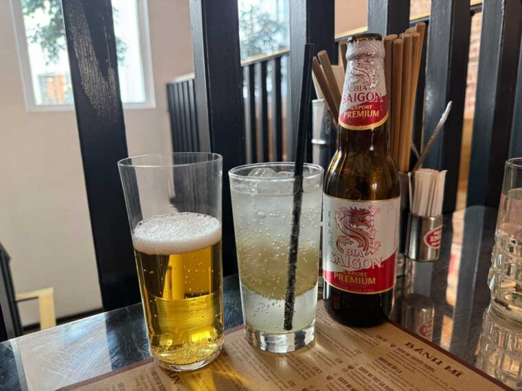 Cô Thành drinks: Saigon beer and lime soda
