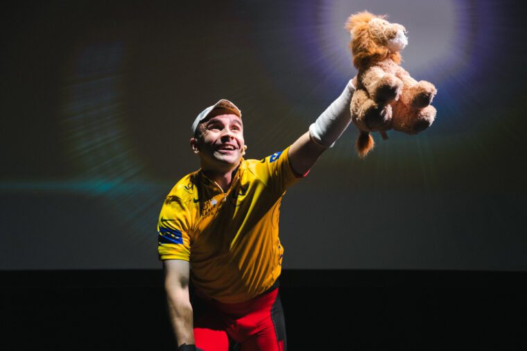 Connor Delves in Cadel with lion - credit Kyle Dax Smith